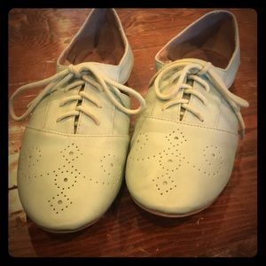 Restricted genuine leather flats